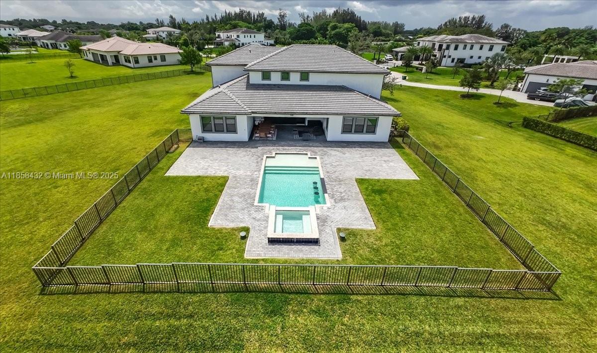 17819 Southwest 58th Street Southwest Ranches, FL 33331 - Photo 52 of 56 a view of a house with a big yard
