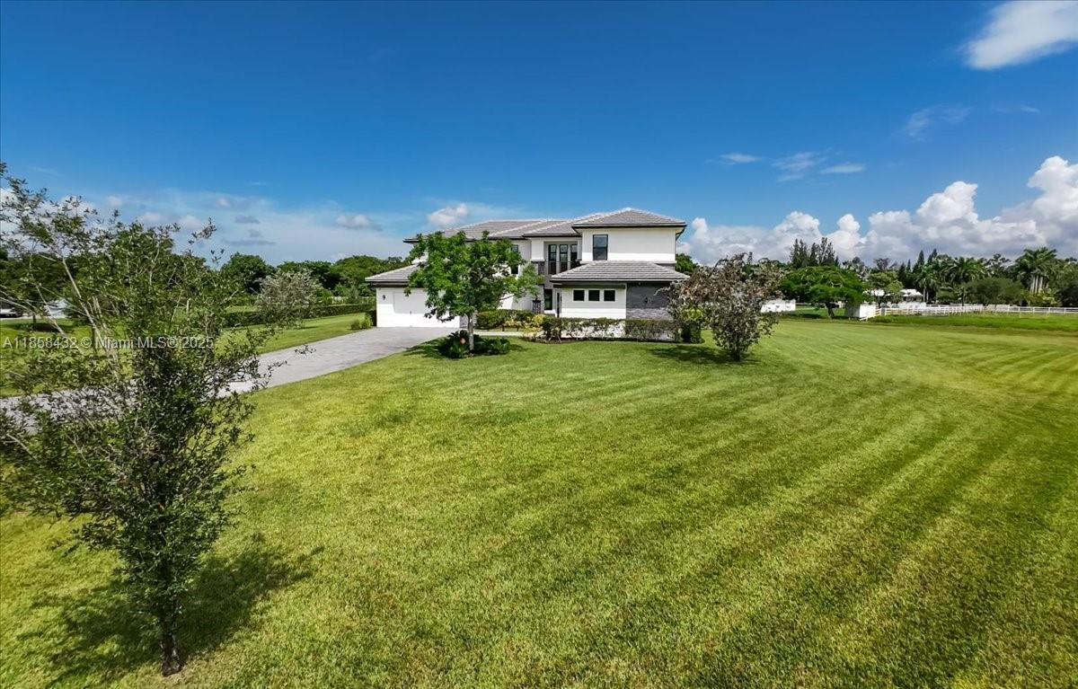 17819 Southwest 58th Street Southwest Ranches, FL 33331 - Photo 54 of 56 a view of a house with a big yard