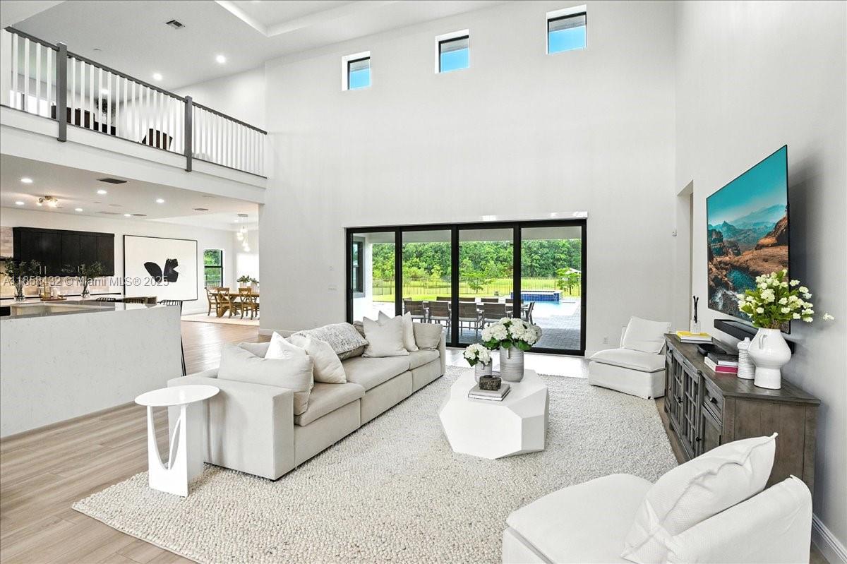 17819 Southwest 58th Street Southwest Ranches, FL 33331 - Photo 6 of 56 a living room with furniture and a large window