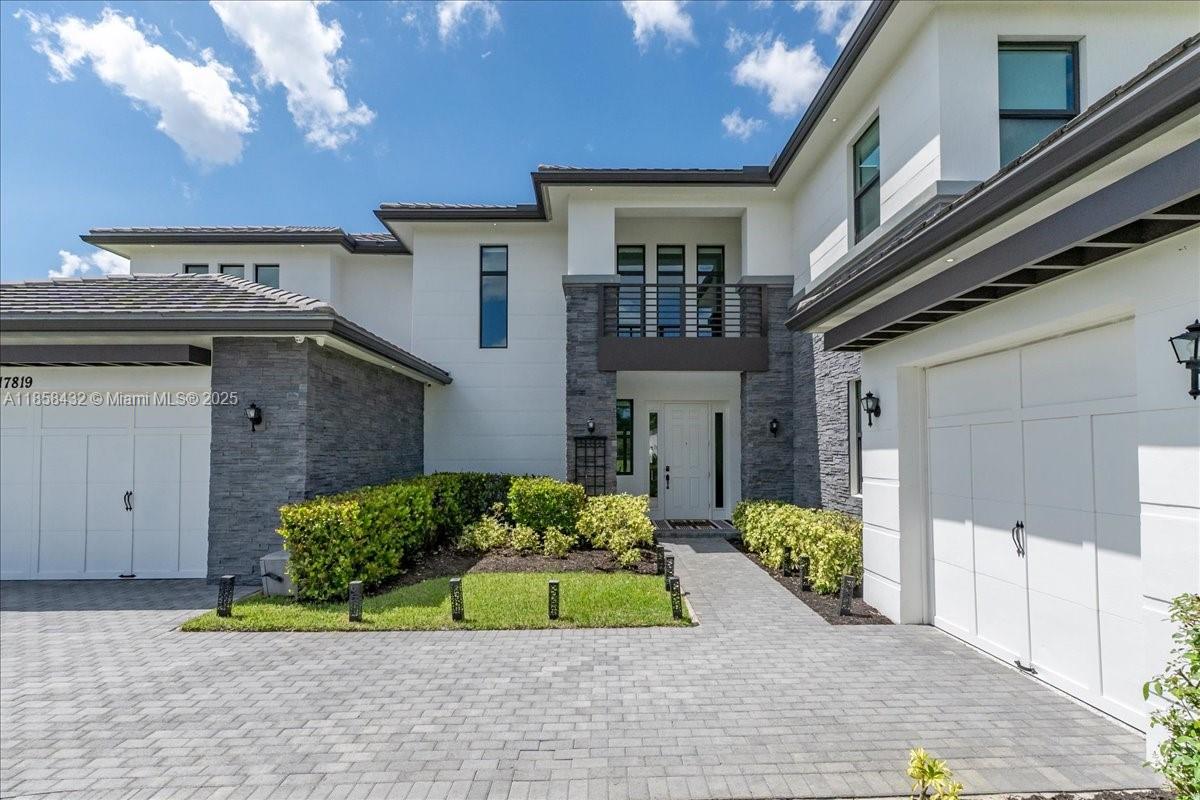 17819 Southwest 58th Street Southwest Ranches, FL 33331 - Photo 9 of 56 a front view of a house with a yard