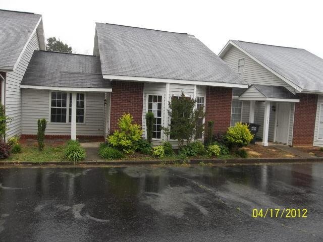 267 Henderson Bend Road Northwest Calhoun, GA 30701 - Photo 1 of 1 a front view of a house with garden