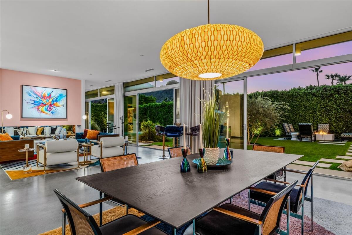 71466 San Gorgonio Road Rancho Mirage, CA 92270 - Photo 21 of 81 a view of a dining room with furniture and chandelier