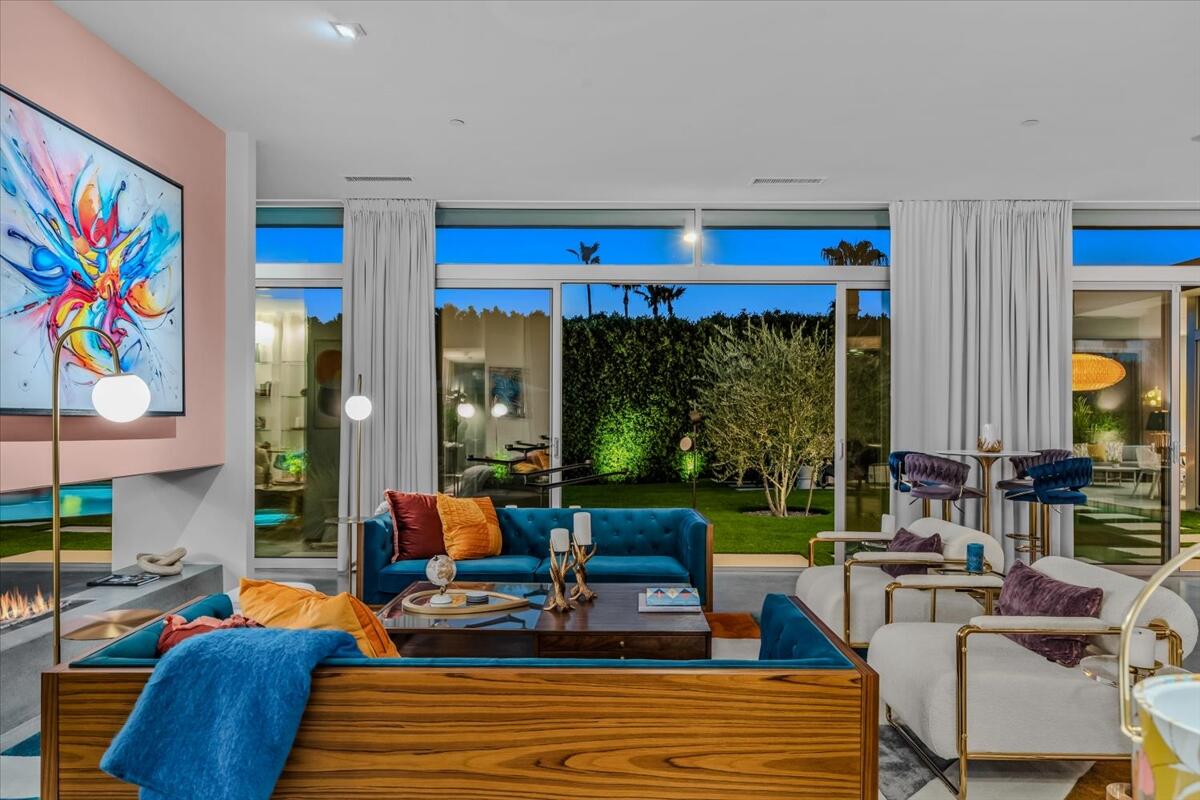 71466 San Gorgonio Road Rancho Mirage, CA 92270 - Photo 22 of 81 a living room with patio furniture and a large window
