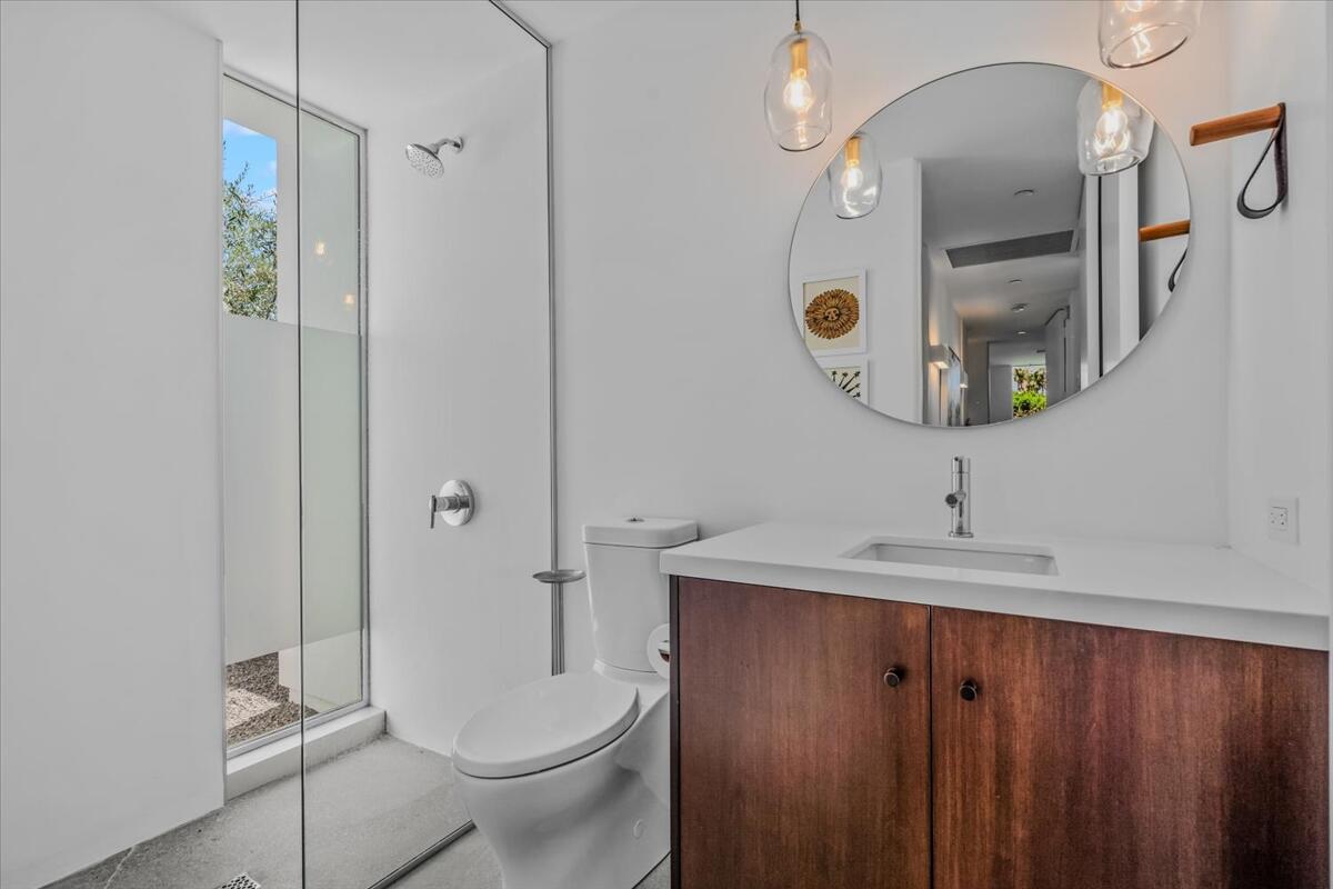 71466 San Gorgonio Road Rancho Mirage, CA 92270 - Photo 39 of 81 a bathroom with a sink a toilet and shower