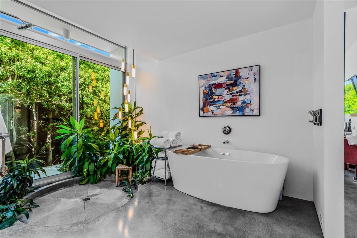 71466 San Gorgonio Road Rancho Mirage, CA 92270 - Photo 43 of 81 a white tub sitting in a room next to a window
