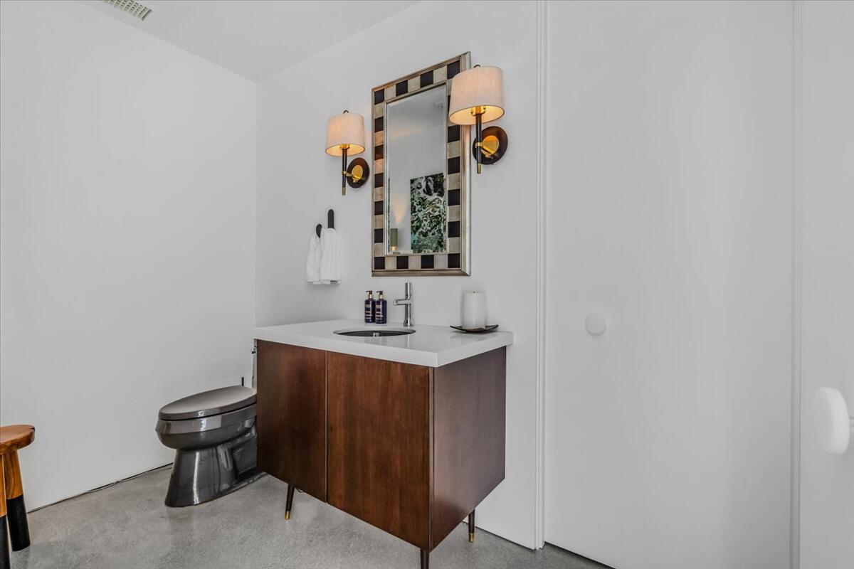 71466 San Gorgonio Road Rancho Mirage, CA 92270 - Photo 54 of 81 a bathroom with a sink and a toilet