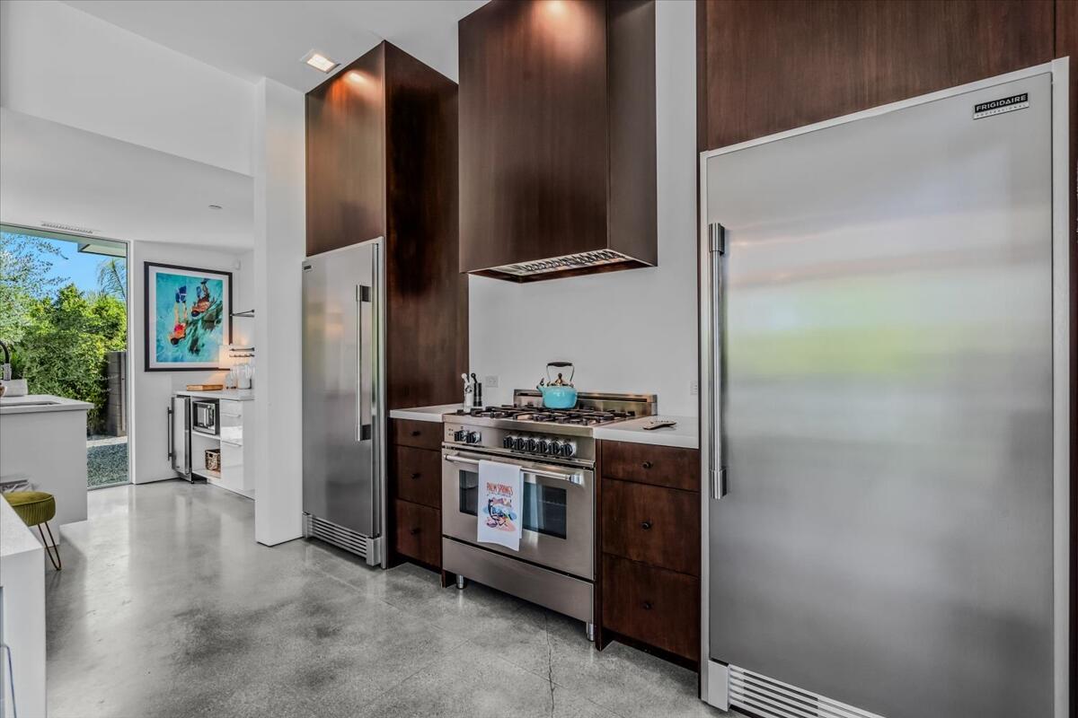 71466 San Gorgonio Road Rancho Mirage, CA 92270 - Photo 63 of 81 a kitchen with stainless steel appliances a stove and a refrigerator