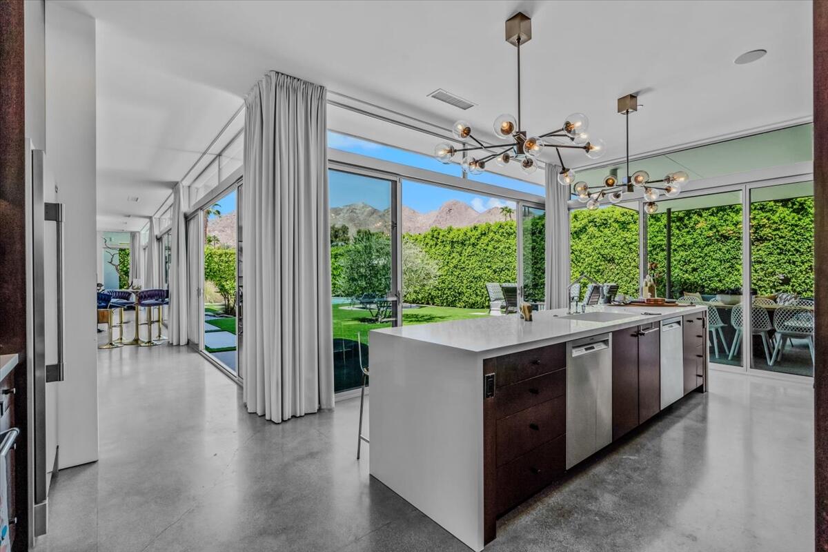 71466 San Gorgonio Road Rancho Mirage, CA 92270 - Photo 66 of 81 a view of a kitchen with kitchen island a large window and stainless steel appliances