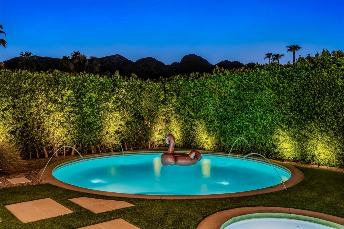 71466 San Gorgonio Road Rancho Mirage, CA 92270 - Photo 8 of 81 a view of a swimming pool with a yard