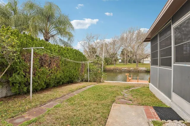 a view of swimming pool with a yard