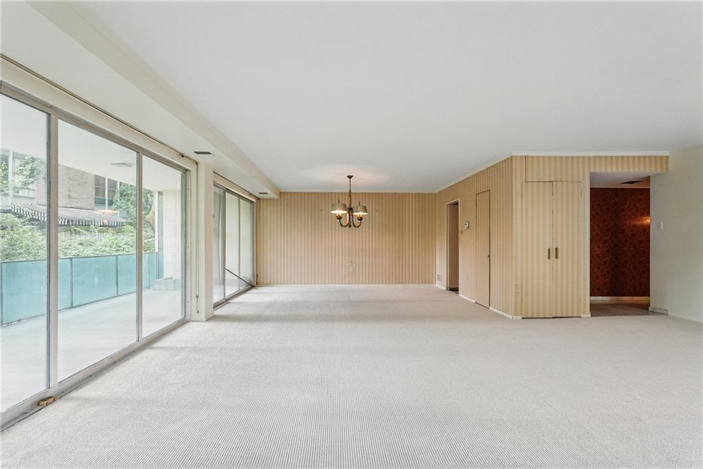 5048 Fifth Avenue, Unit 101 Pittsburgh, PA 15232 - Photo 13 of 24 a view of empty room with floor to ceiling window