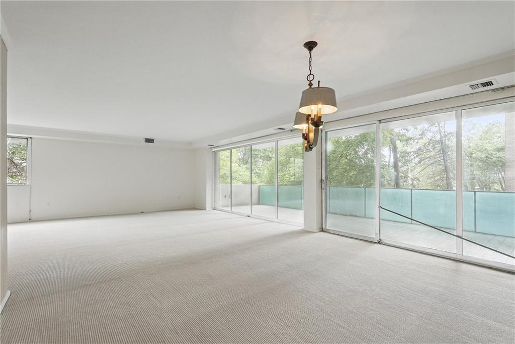 5048 Fifth Avenue, Unit 101 Pittsburgh, PA 15232 - Photo 14 of 24 a view of empty room with wooden floor and fan