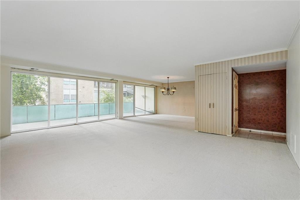 5048 Fifth Avenue, Unit 101 Pittsburgh, PA 15232 - Photo 6 of 24 a view of an empty room with a window