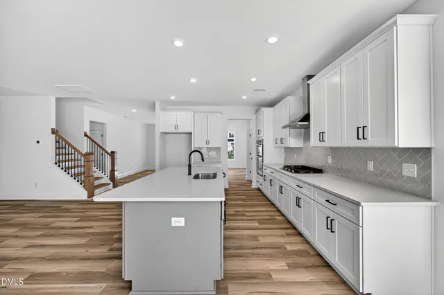 a kitchen with stainless steel appliances lots of counter top space
