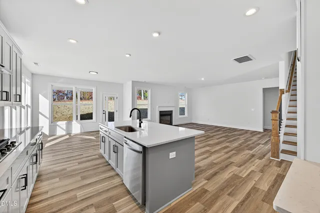 a large room with a bed and a table in it