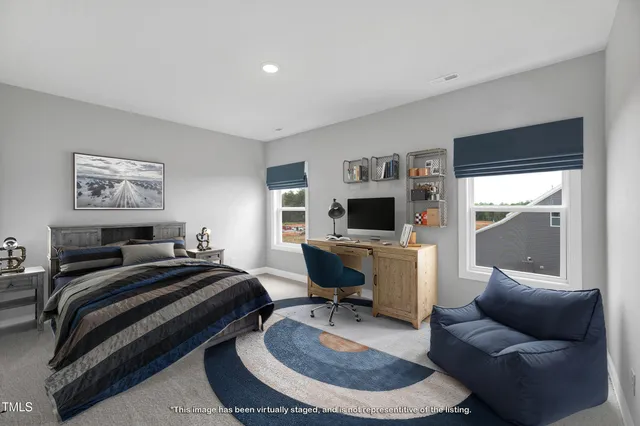 a bedroom with a bed and a couch