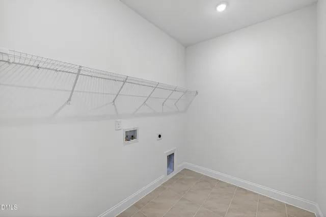 a view of a utility room with racks on the wall