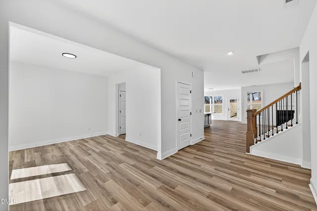 a view of an entryway with wooden floor
