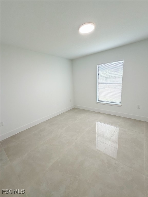 2800 46th Street Southwest Lehigh Acres, FL 33976 - Photo 11 of 15 an empty room with a window