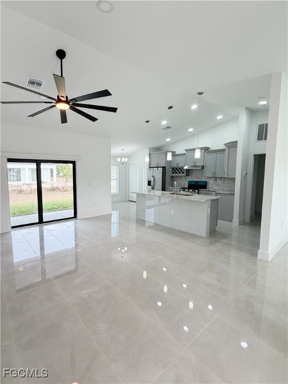 2800 46th Street Southwest Lehigh Acres, FL 33976 - Photo 4 of 15 a view of a kitchen with a sink stainless steel appliances and cabinets