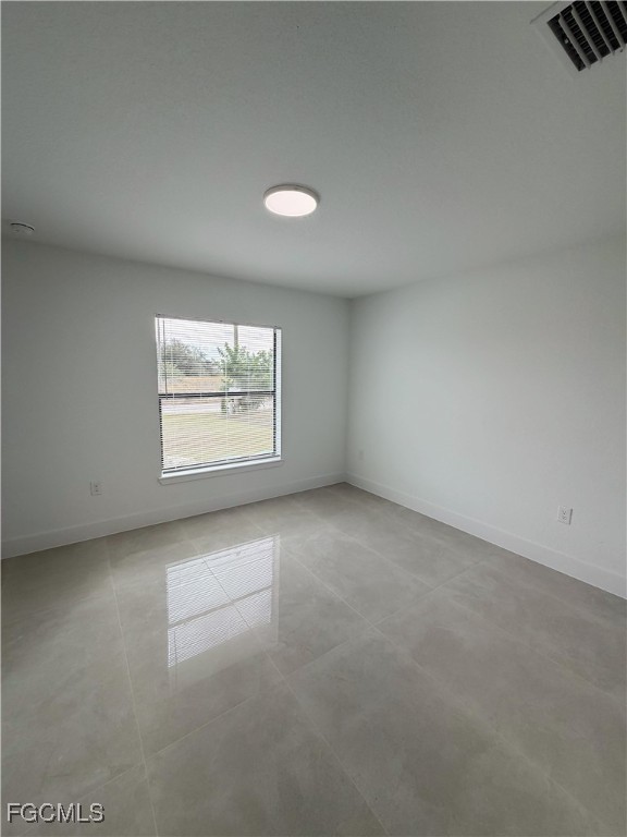 2800 46th Street Southwest Lehigh Acres, FL 33976 - Photo 10 of 15 an empty room with windows