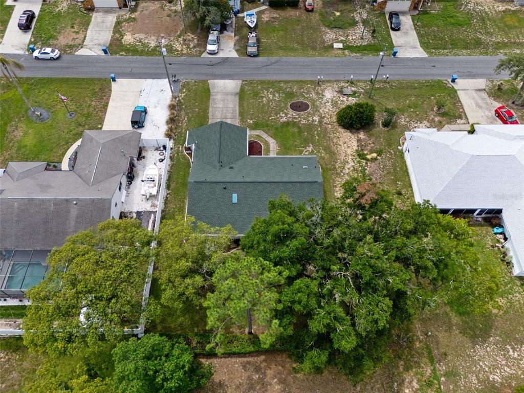 5035 Harbinger Road Spring Hill, FL 34608 - Photo 5 of 47 an aerial view of a house with outdoor space