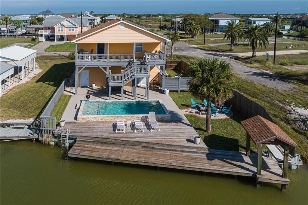 a view of swimming pool with outdoor seating and yard