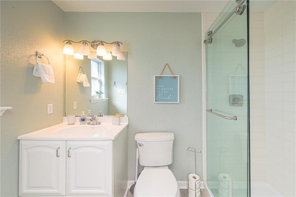 102 Ball Street Rockport, TX 78382 - Photo 14 of 40 a bathroom with a sink toilet and shower