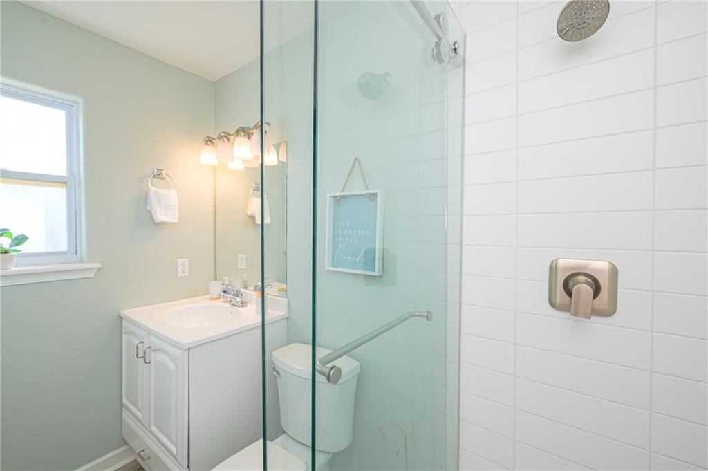 102 Ball Street Rockport, TX 78382 - Photo 15 of 40 a bathroom with a sink and a mirror
