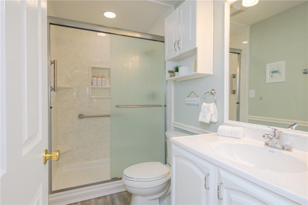 102 Ball Street Rockport, TX 78382 - Photo 18 of 40 a bathroom with a sink a toilet and shower