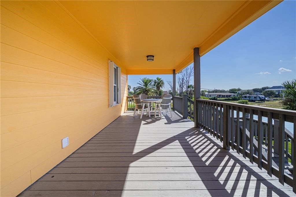 102 Ball Street Rockport, TX 78382 - Photo 27 of 40 a view of a balcony with wooden floor and seating space