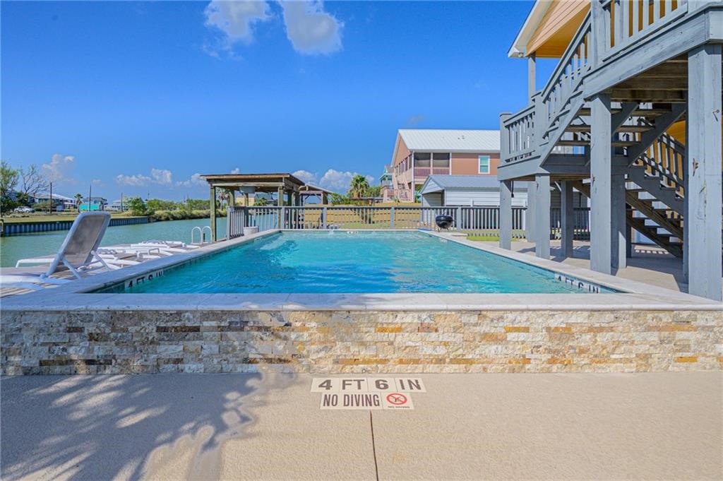 102 Ball Street Rockport, TX 78382 - Photo 32 of 40 a view of a house with a yard