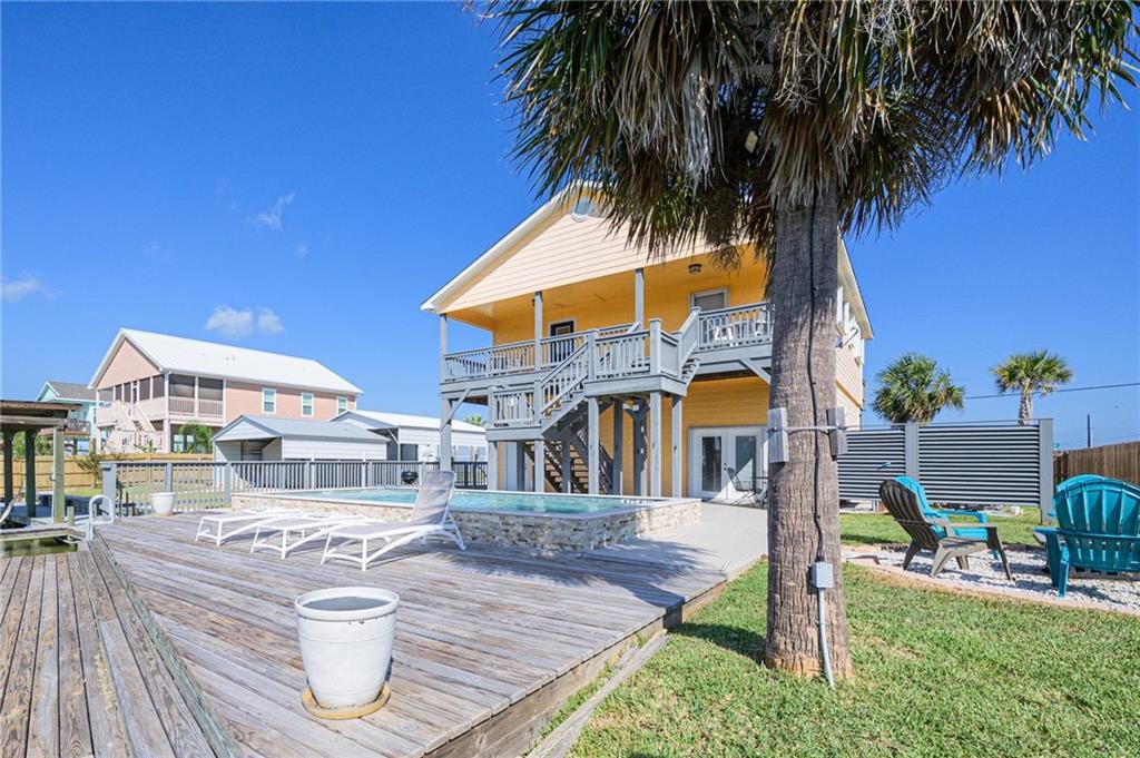 102 Ball Street Rockport, TX 78382 - Photo 33 of 40 a view of a house with a swimming pool