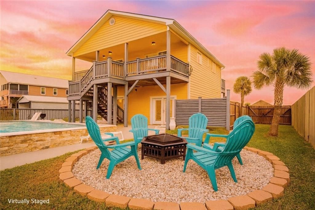 102 Ball Street Rockport, TX 78382 - Photo 34 of 40 a backyard of a house with barbeque oven table and chairs