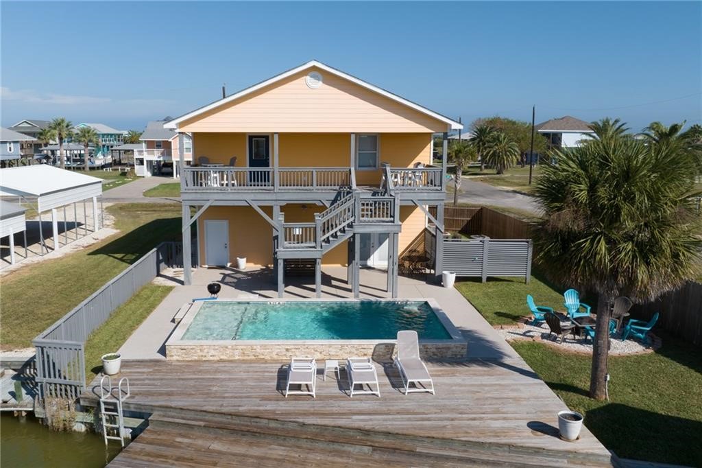 102 Ball Street Rockport, TX 78382 - Photo 4 of 40 a view of a swimming pool with a patio