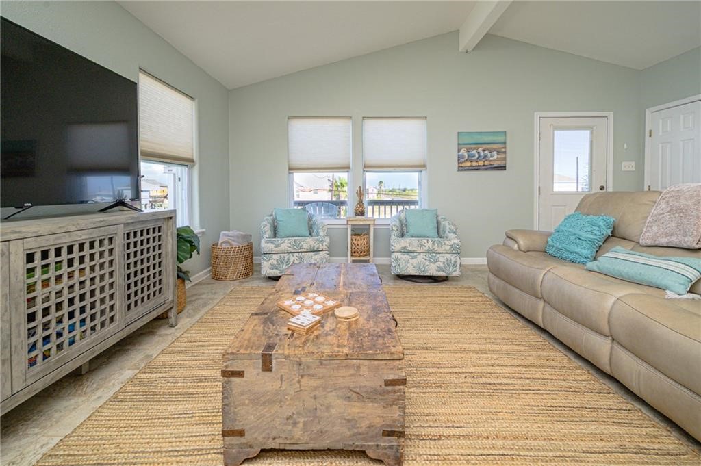 102 Ball Street Rockport, TX 78382 - Photo 6 of 40 a living room with furniture and a flat screen tv