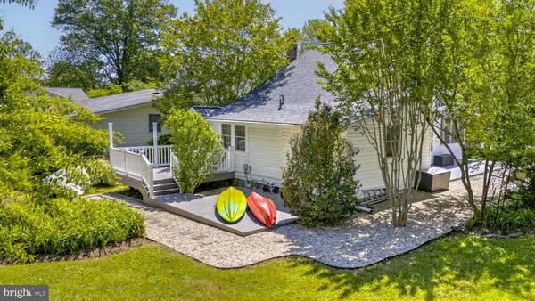 a aerial view of a house with swimming pool and big yard