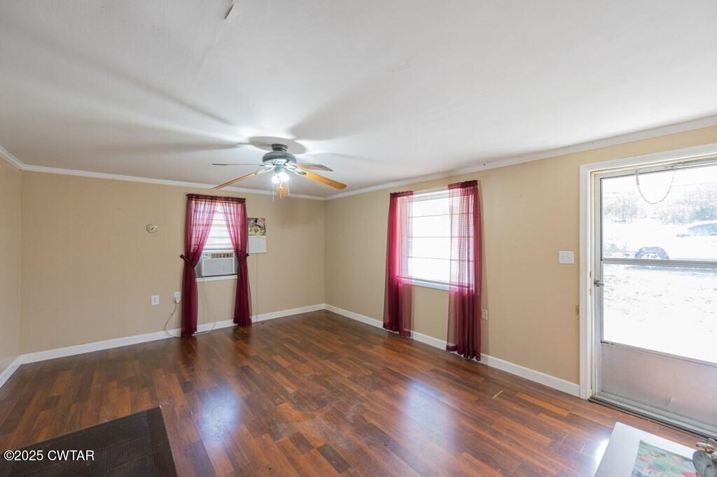 8405 Highway 77 Huntingdon, TN 38344 - Photo 12 of 37 an empty room with wooden floor and windows