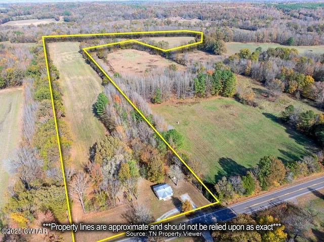 a view of swimming pool with a yard and seating space