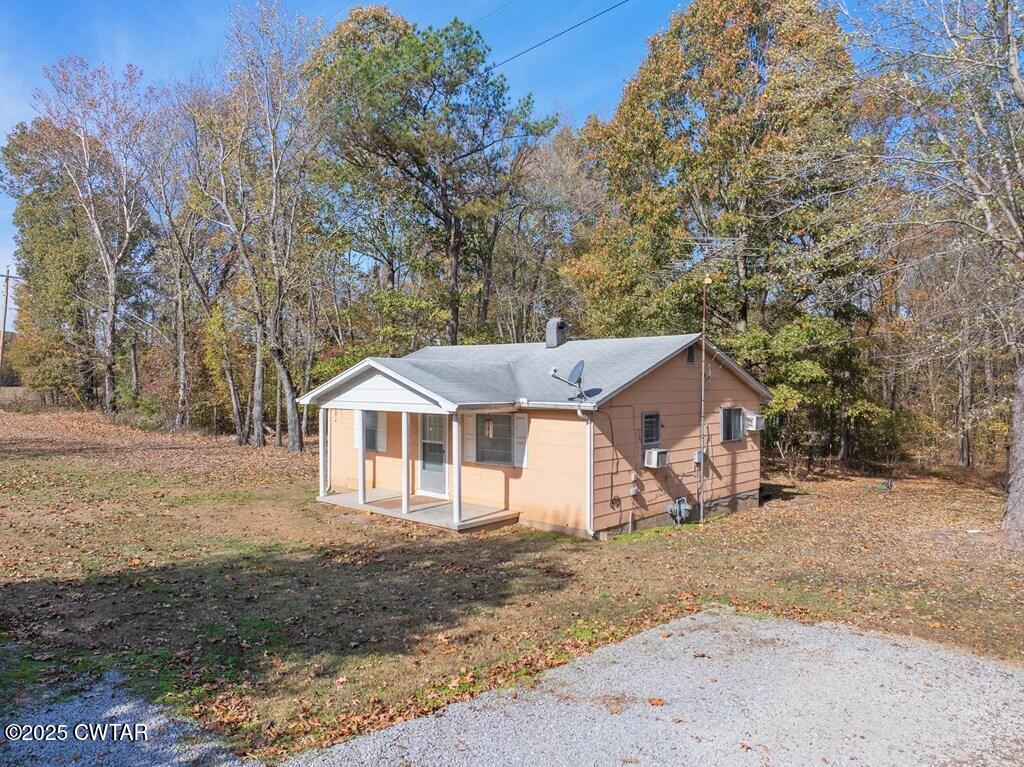 8405 Highway 77 Huntingdon, TN 38344 - Photo 36 of 37 a house with trees in front of it