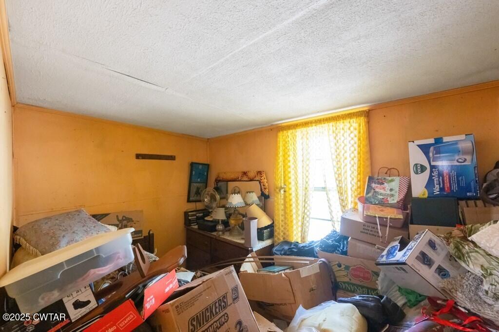 8405 Highway 77 Huntingdon, TN 38344 - Photo 6 of 37 a bedroom with furniture and a large window