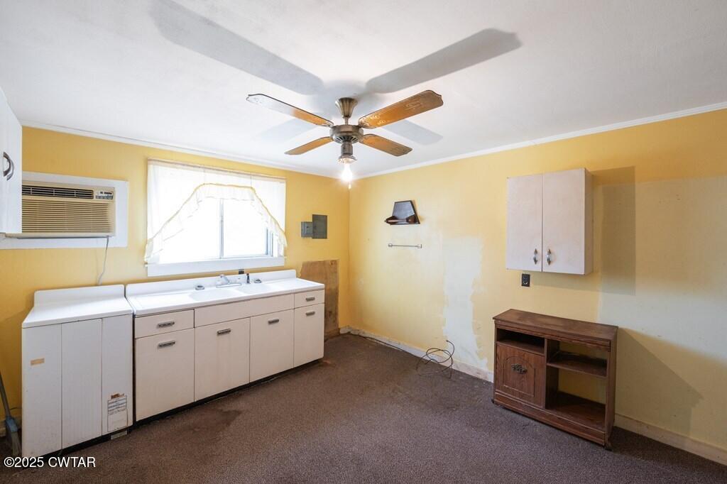 8405 Highway 77 Huntingdon, TN 38344 - Photo 10 of 37 a bathroom with a double vanity sink and a mirror