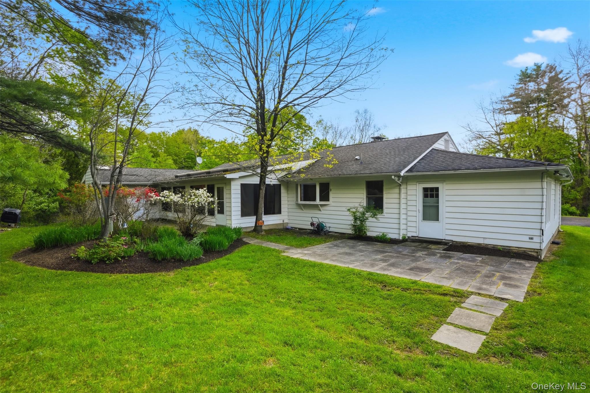 435 Samsonville Road Kerhonkson, NY 12446 - Photo 32 of 37 a front view of a house with a garden and yard