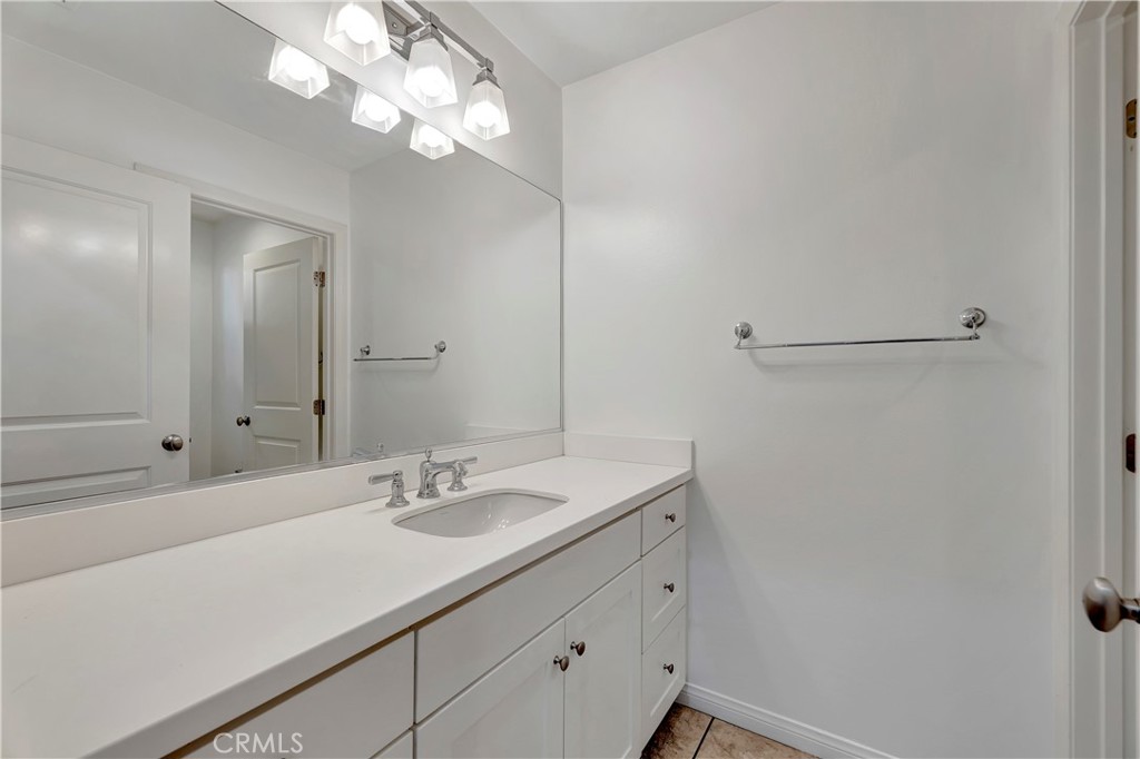 110 Mosswood Irvine, CA 92620 - Photo 11 of 38 a bathroom with a sink vanity and a mirror