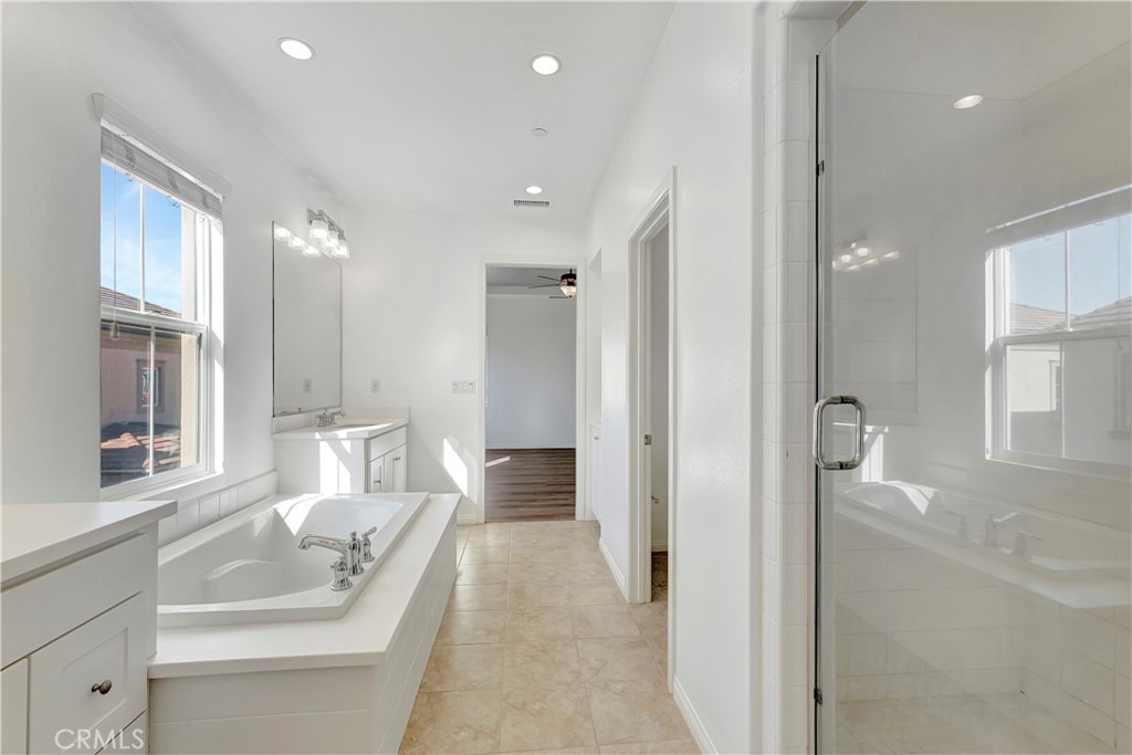 110 Mosswood Irvine, CA 92620 - Photo 17 of 38 a bathroom with a sink and a mirror