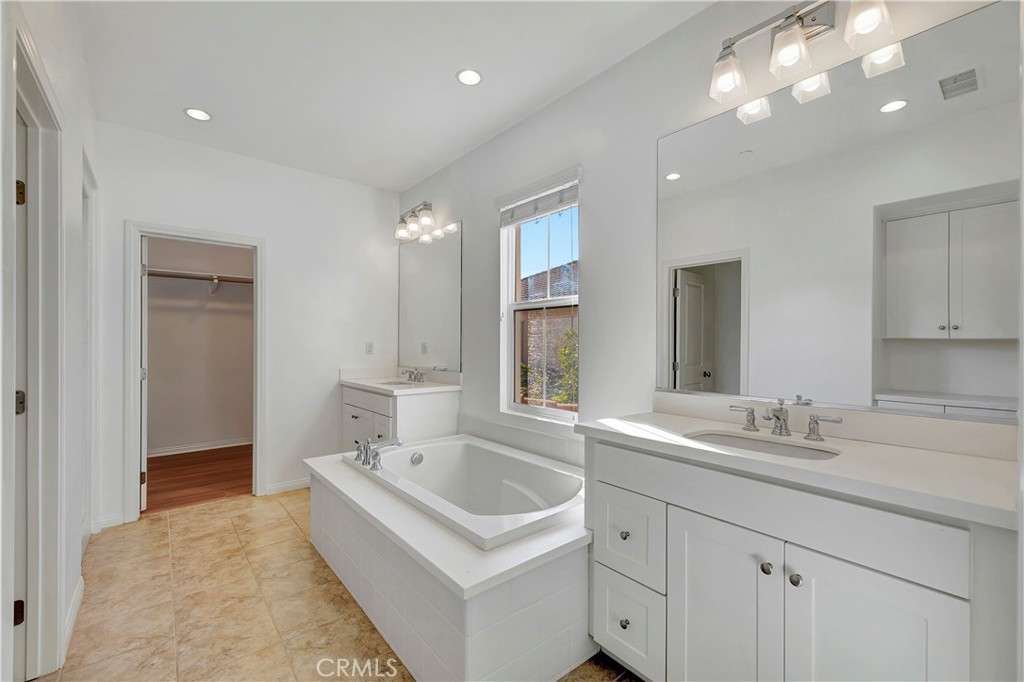 110 Mosswood Irvine, CA 92620 - Photo 18 of 38 a bathroom with a sink double vanity granite and a bathtub