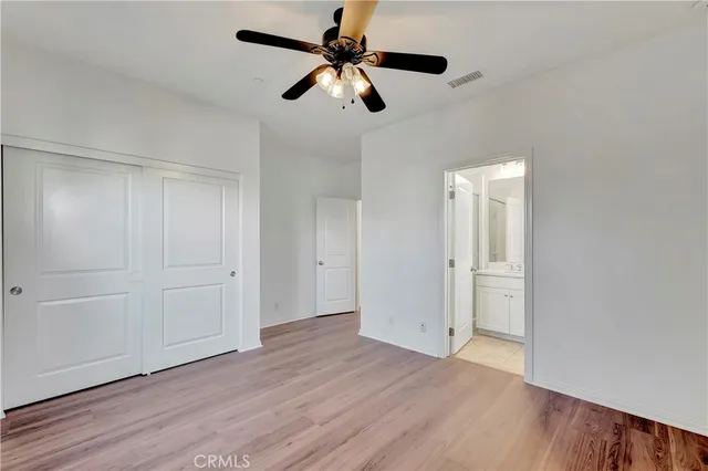 a view of an empty room and wooden floor