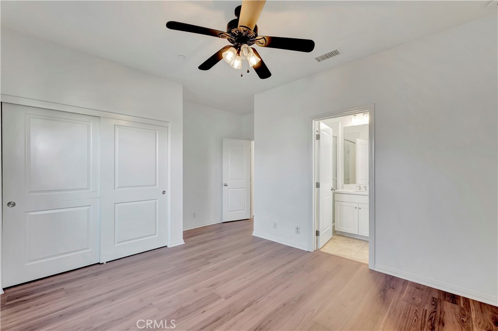 110 Mosswood Irvine, CA 92620 - Photo 20 of 38 a view of an empty room and wooden floor