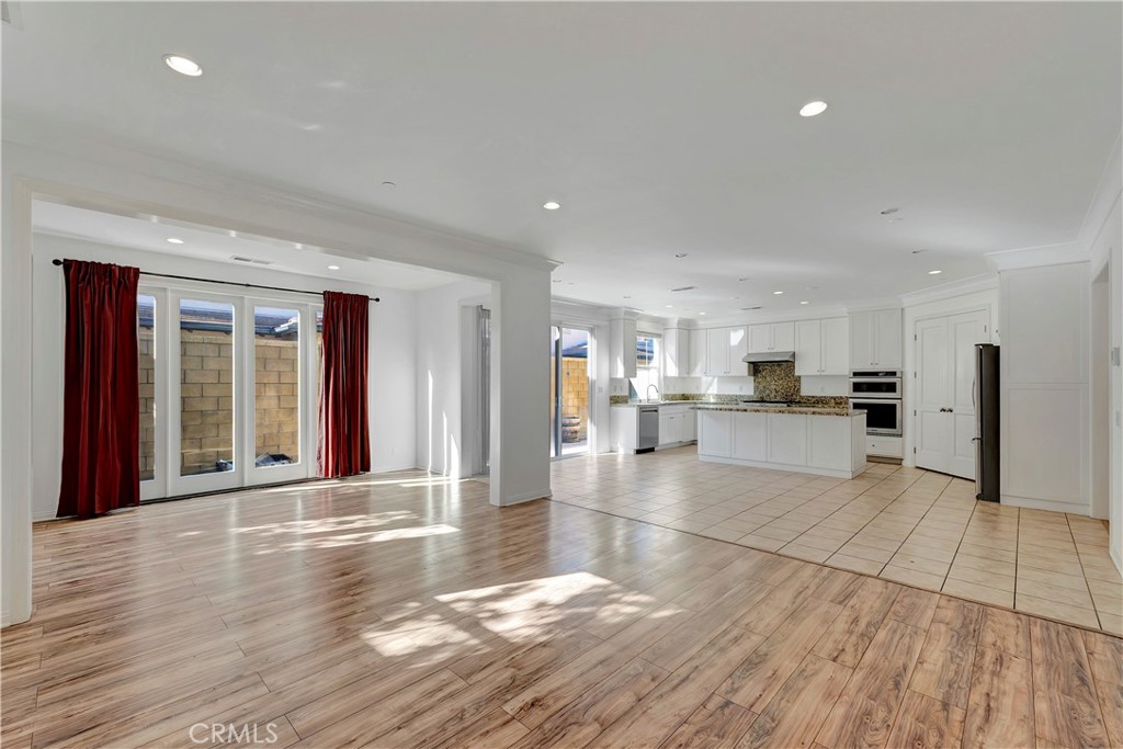110 Mosswood Irvine, CA 92620 - Photo 2 of 38 a view of large hall with wooden floor and a large window