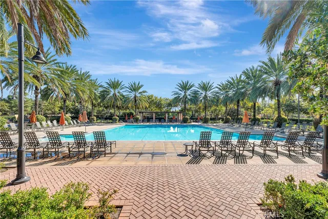 a view of a swimming pool with outdoor seating